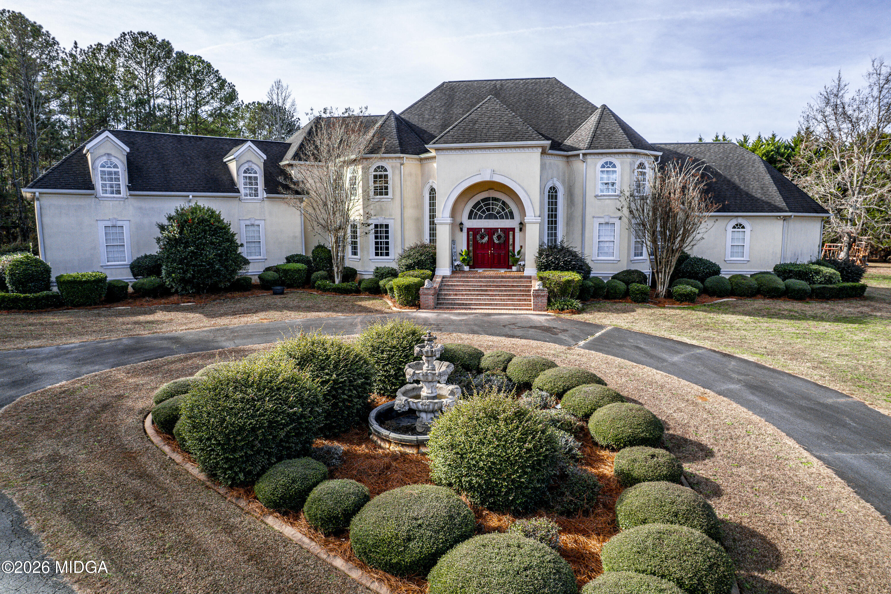 354 Lite-N-Tie Road Gray, GA 31032 - Photo 6 of 110 a front view of a house with a yard and outdoor seating