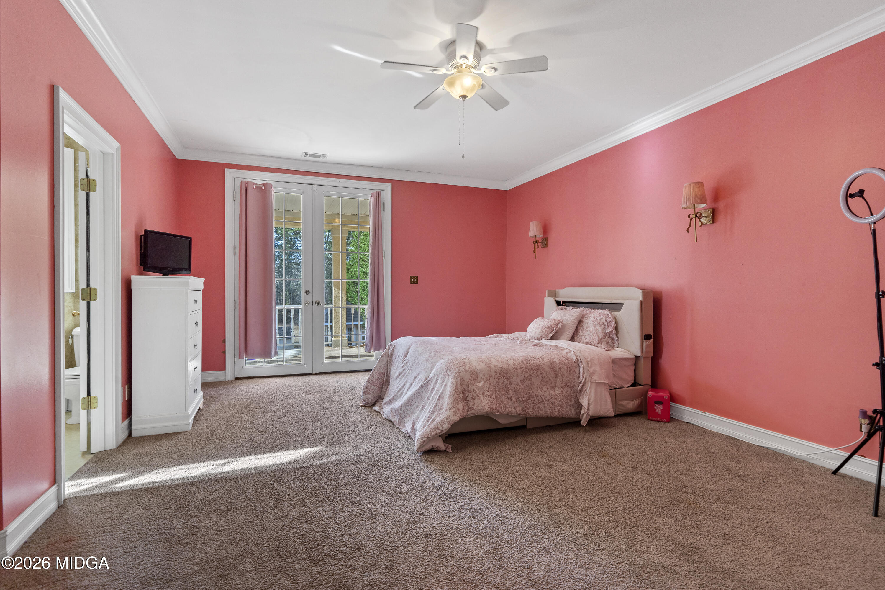 354 Lite-N-Tie Road Gray, GA 31032 - Photo 75 of 110 a bed room with a bed and a chandelier