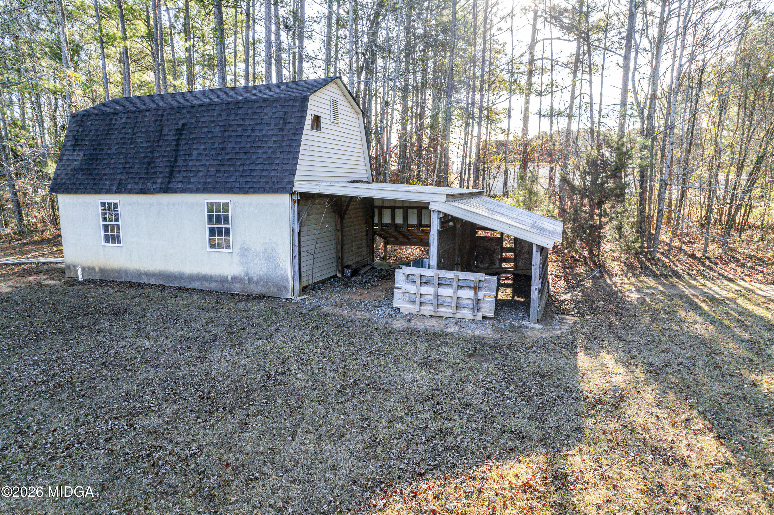354 Lite-N-Tie Road Gray, GA 31032 - Photo 89 of 110 a front view of a house with a yard and garage