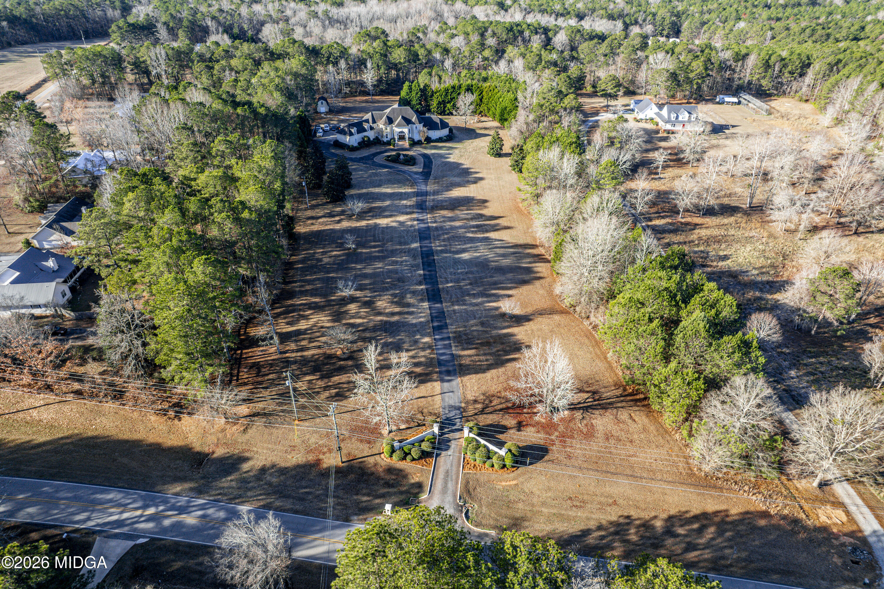 354 Lite-N-Tie Road Gray, GA 31032 - Photo 99 of 110 a view of a yard with plants and large trees