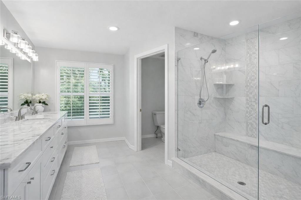 7395 Stonegate Drive Naples, FL 34109 - Photo 24 of 45 a bathroom with a shower