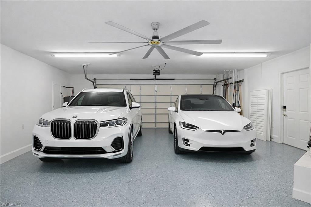 7395 Stonegate Drive Naples, FL 34109 - Photo 39 of 45 a car parked in garage