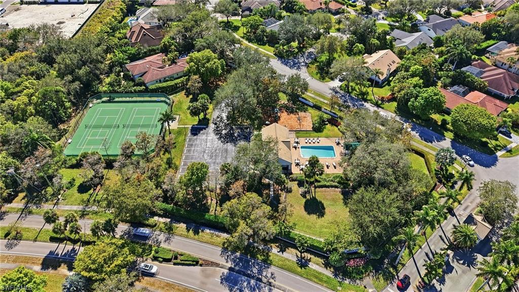 7395 Stonegate Drive Naples, FL 34109 - Photo 44 of 45 an aerial view of residential houses with outdoor space and trees all around