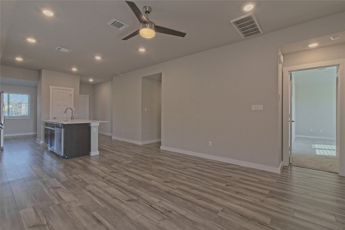 112 Halford Road Georgetown, TX 78633 - Photo 17 of 37 Unfurnished living room featuring recessed lighting, light wood-type flooring, and ceiling fan