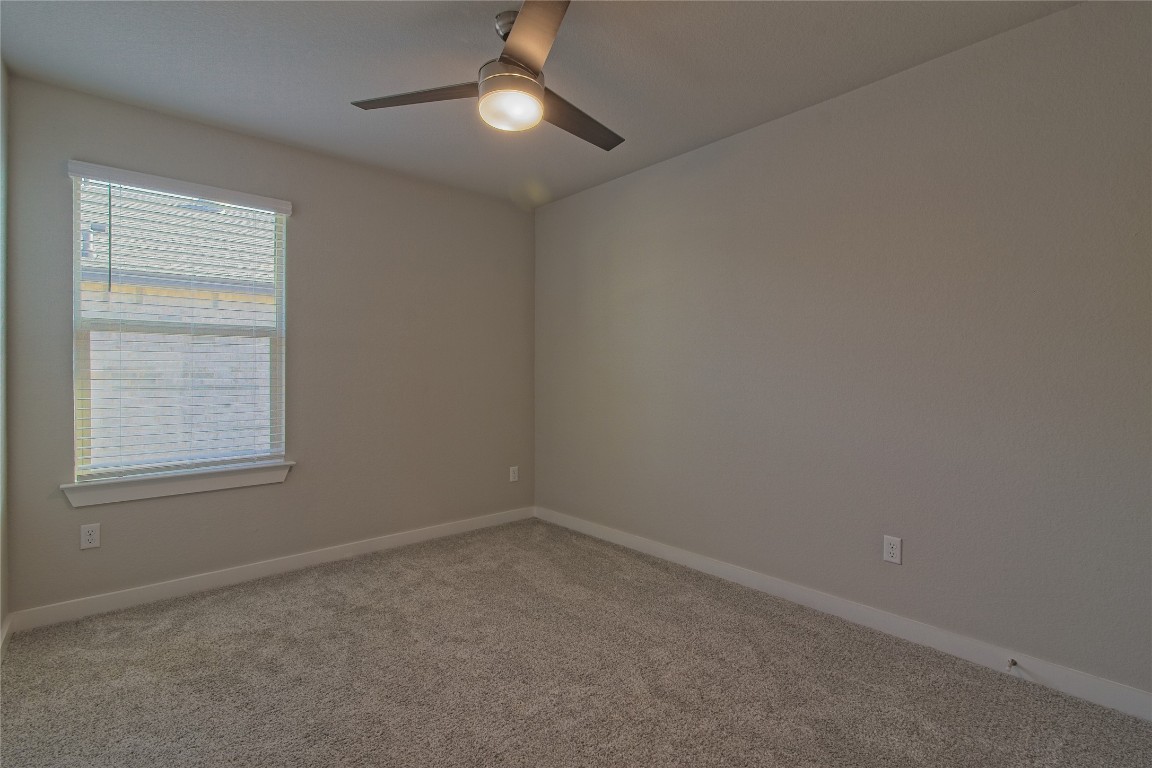 112 Halford Road Georgetown, TX 78633 - Photo 23 of 37 Carpeted empty room featuring baseboards and a ceiling fan