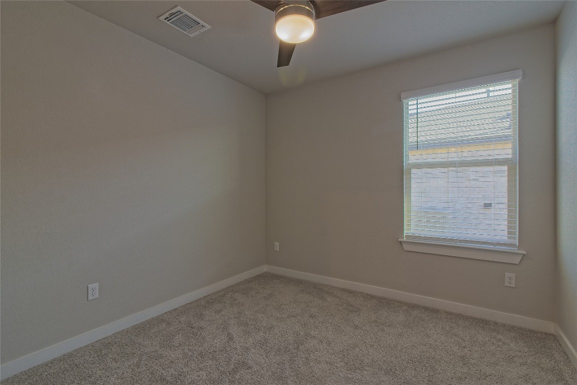 112 Halford Road Georgetown, TX 78633 - Photo 24 of 37 Unfurnished room featuring light carpet and a ceiling fan