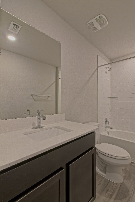 112 Halford Road Georgetown, TX 78633 - Photo 25 of 37 Bathroom with shower / bath combination, vanity, and light wood-style flooring