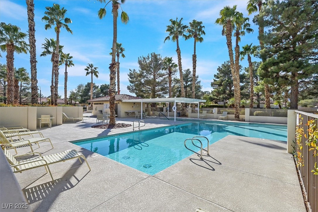 5421 Painted Mirage Road Las Vegas, NV 89149 - Photo 26 of 35 Community pool featuring a patio area and fence