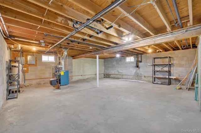 a view of empty room with wooden ceiling