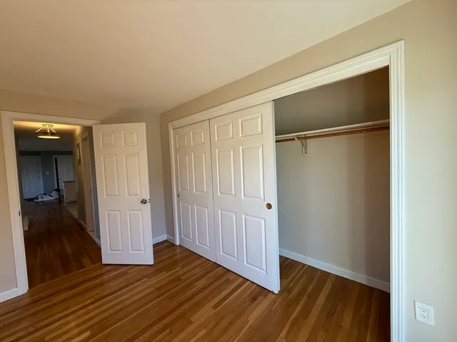 a view of a livingroom with wooden floor