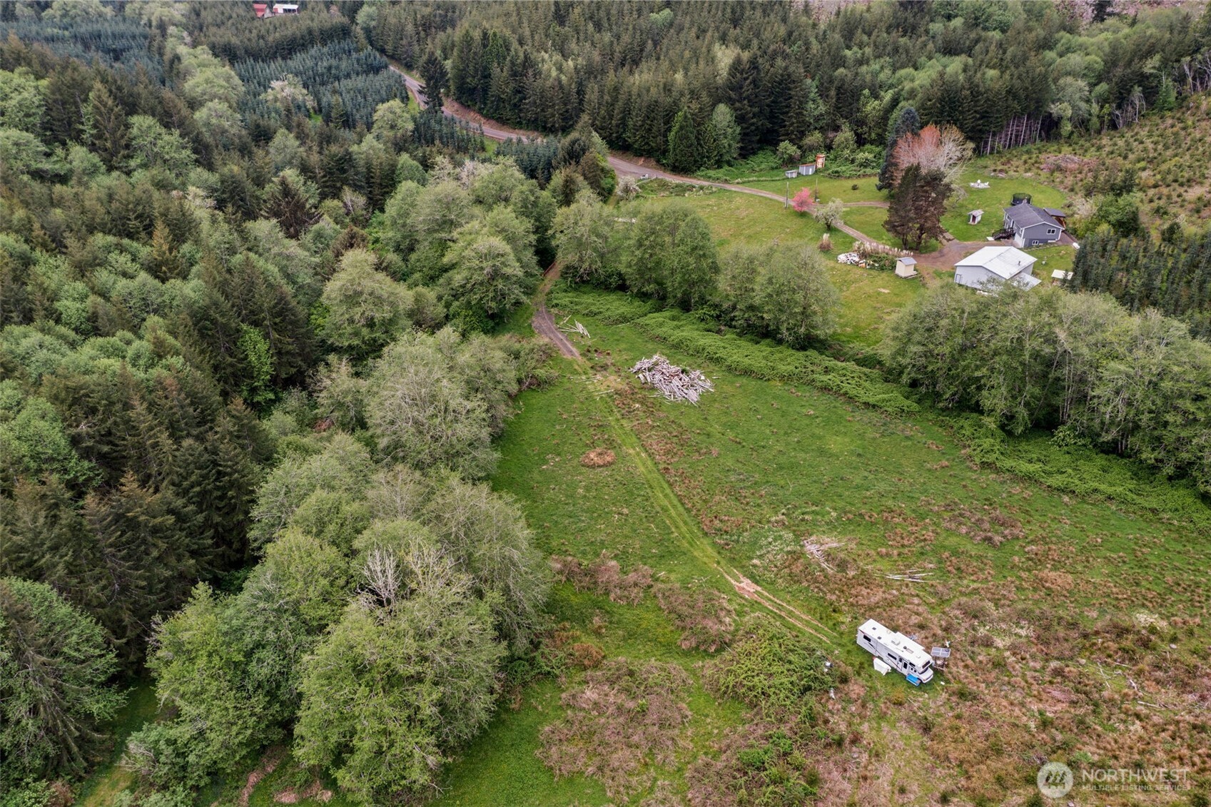 X Elk Creek Road Raymond, WA 98577 - Photo 10 of 13 a backyard of a house with a yard and lake view