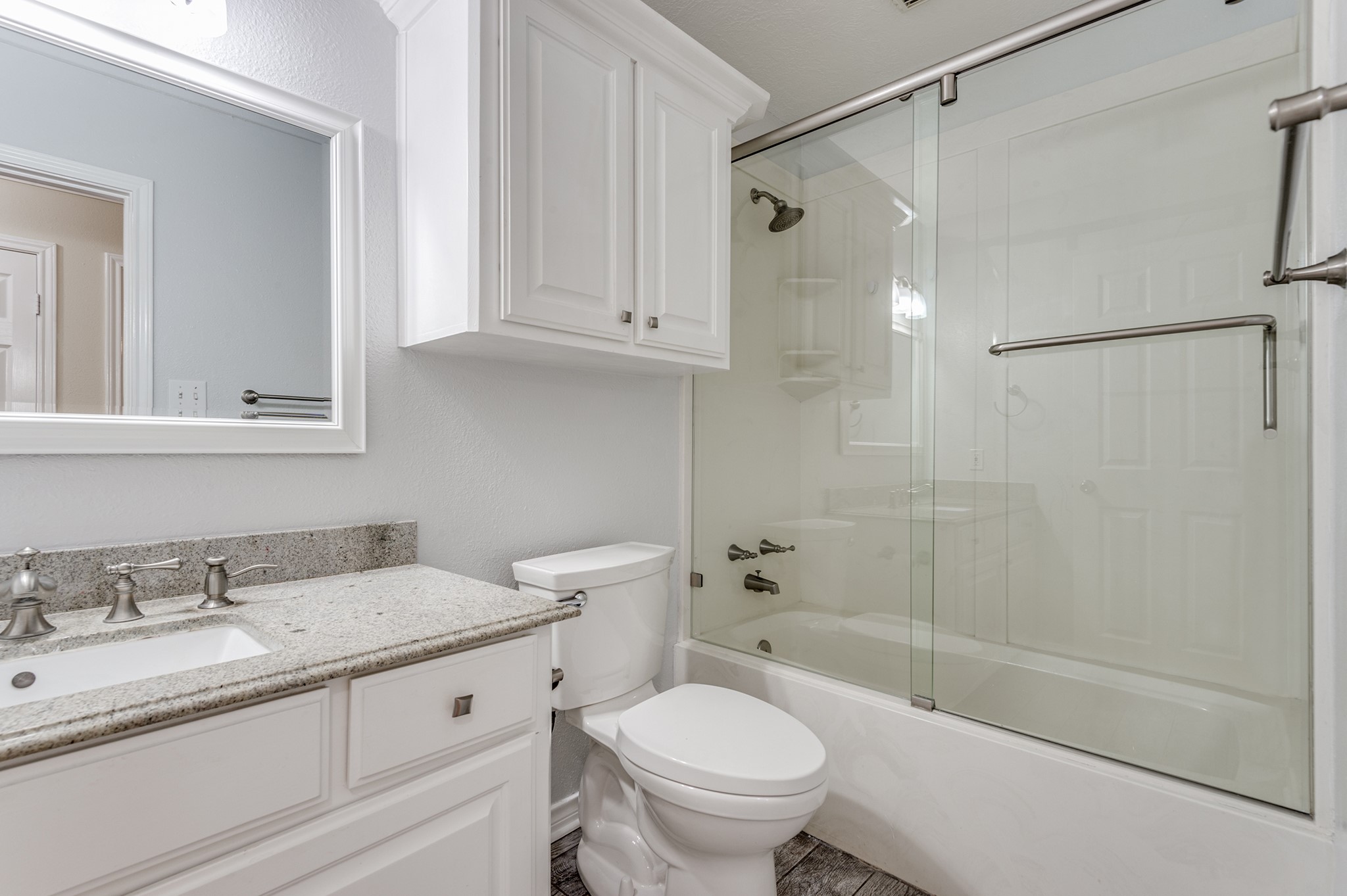 341 Sam Houston Loop Point Blank, TX 77364 - Photo 21 of 36 a bathroom with a granite countertop sink toilet and shower