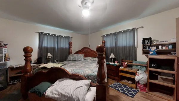 a bed room with a bed and a window