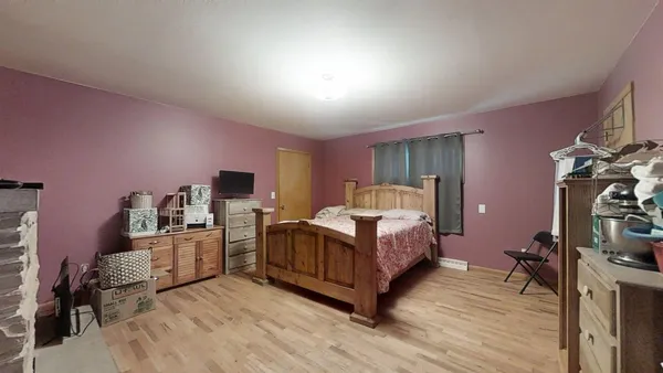 a room with furniture and a flat screen tv