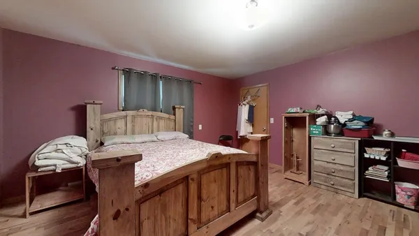 a bedroom with a bed and furniture