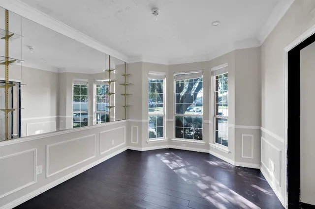 a view of an entryway with wooden floor and windows