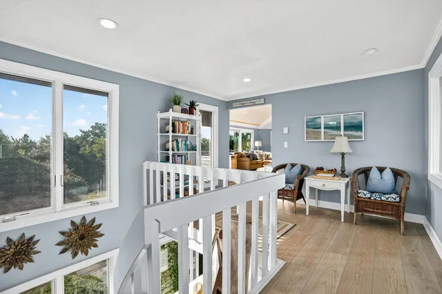 a bedroom with furniture and a book shelf