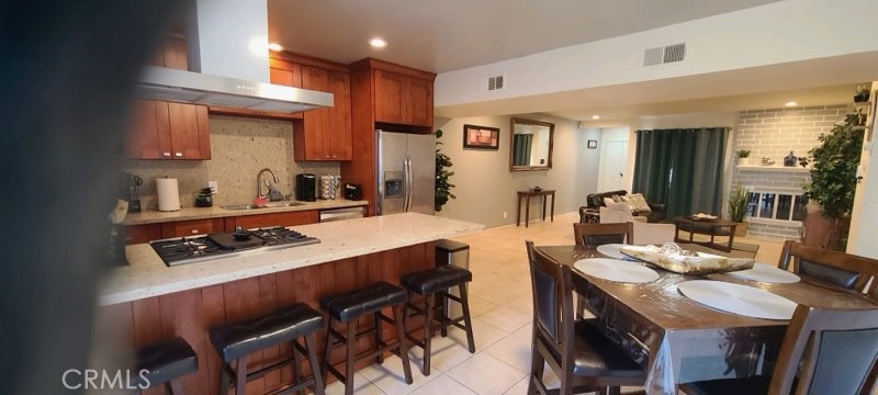 1851 Glenoaks Avenue, Unit C Anaheim, CA 92801 - Photo 15 of 21 a view of a dining room with furniture and a kitchen