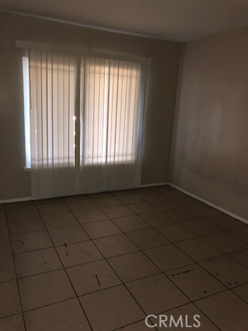 1851 Glenoaks Avenue, Unit C Anaheim, CA 92801 - Photo 8 of 21 an empty room with a window