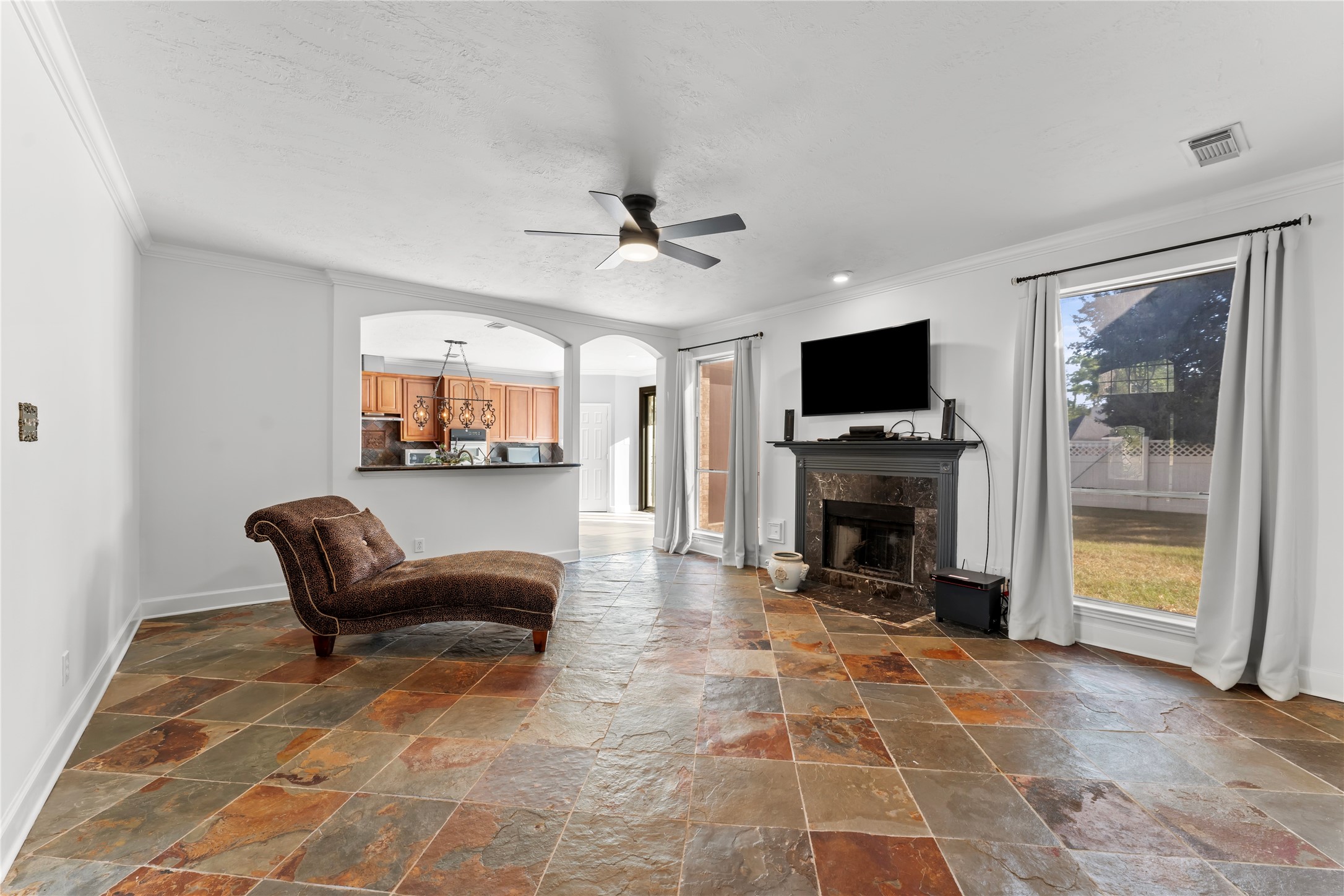 2922 Travick Lane Houston, TX 77073 - Photo 14 of 49 a living room with furniture a fireplace and a flat screen tv