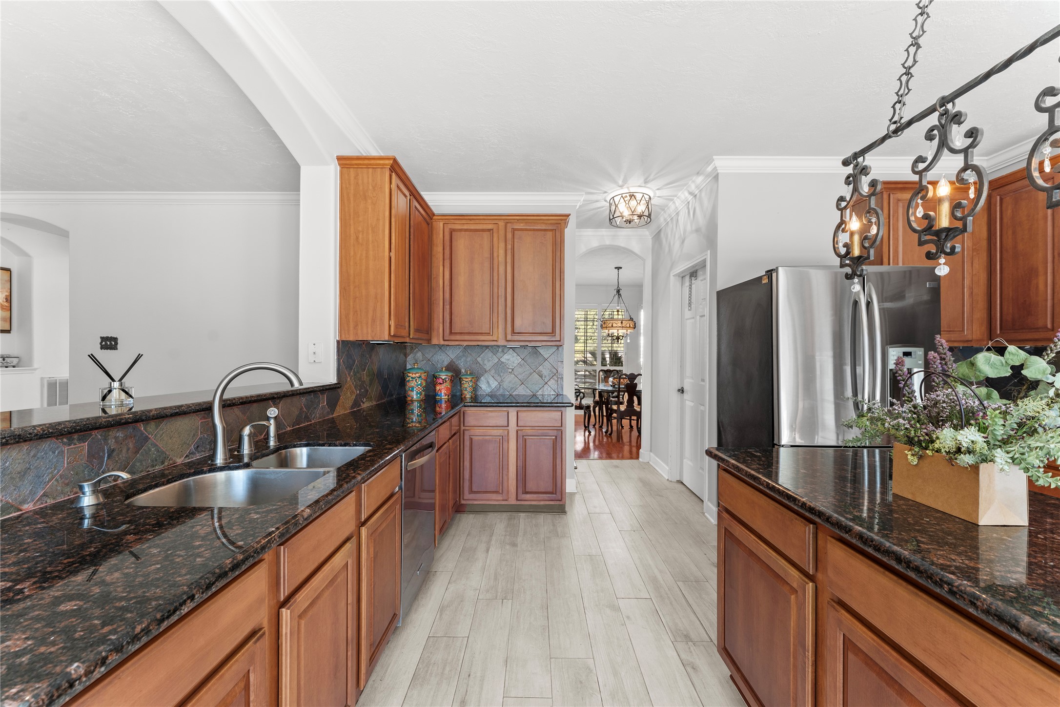 2922 Travick Lane Houston, TX 77073 - Photo 16 of 49 a kitchen with stainless steel appliances granite countertop a sink stove and refrigerator