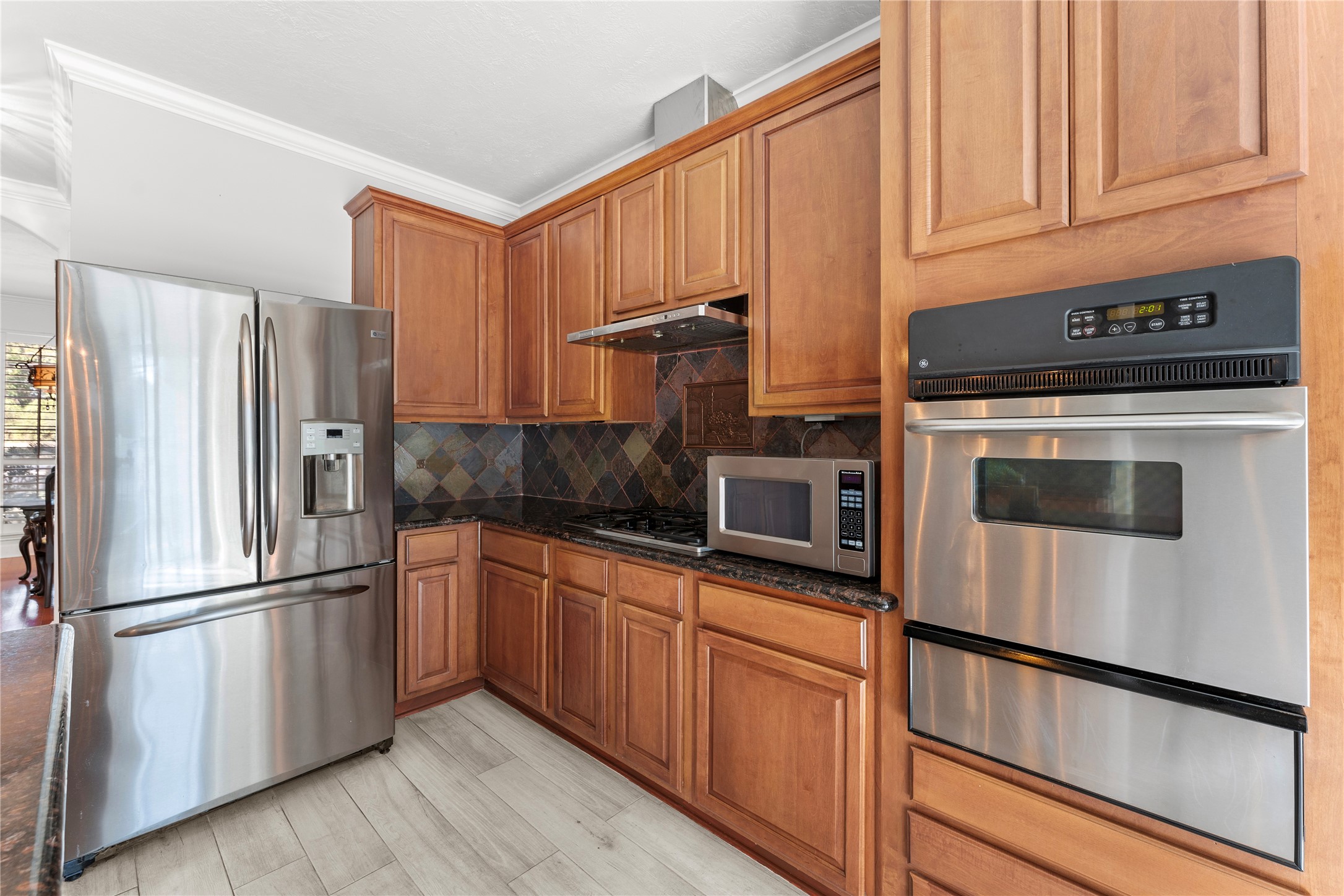 2922 Travick Lane Houston, TX 77073 - Photo 18 of 49 a kitchen with stainless steel appliances granite countertop a refrigerator sink and microwave