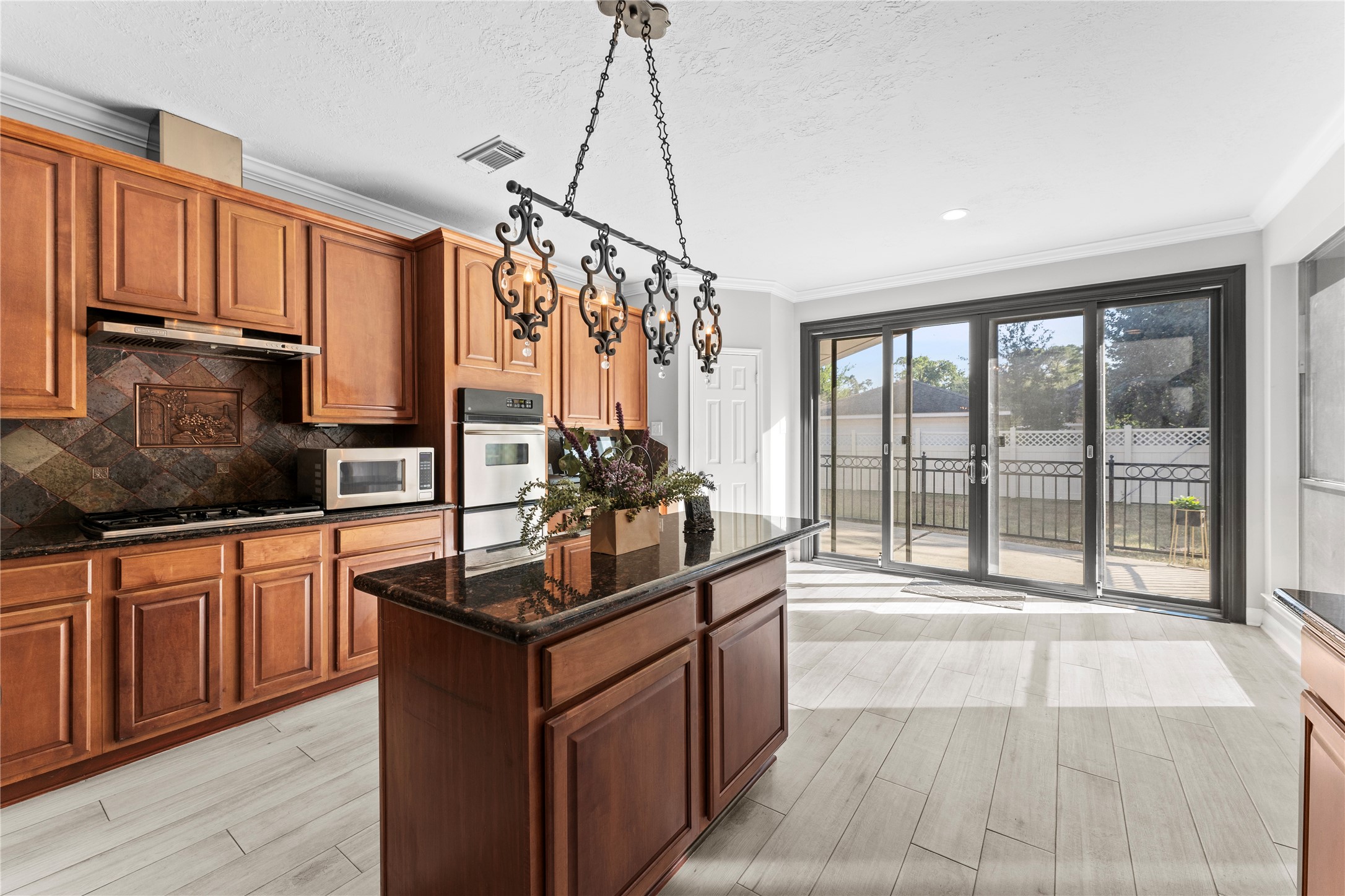 2922 Travick Lane Houston, TX 77073 - Photo 19 of 49 a kitchen with granite countertop a sink stove and cabinets