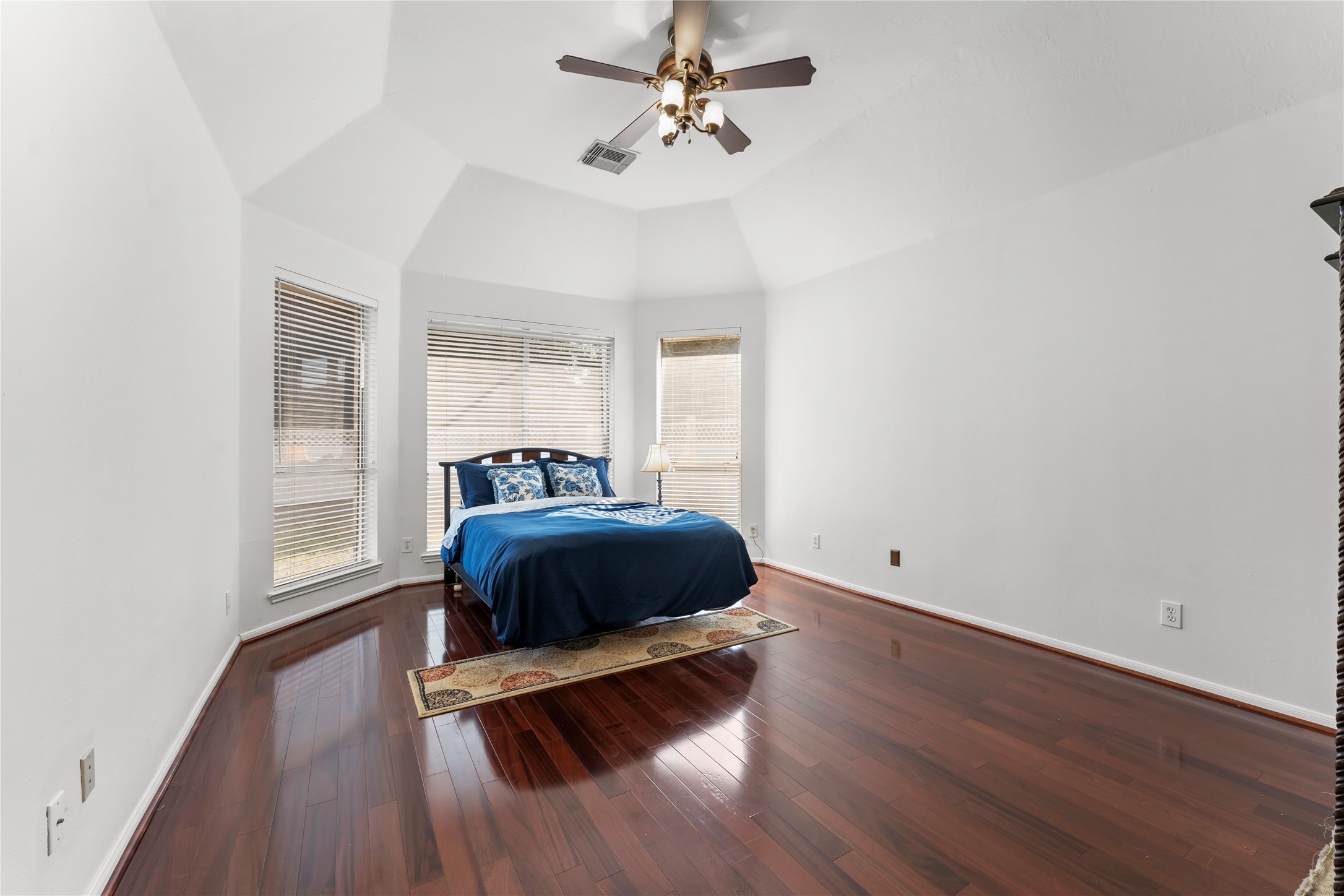 2922 Travick Lane Houston, TX 77073 - Photo 23 of 49 a bedroom with a bed and wooden floor