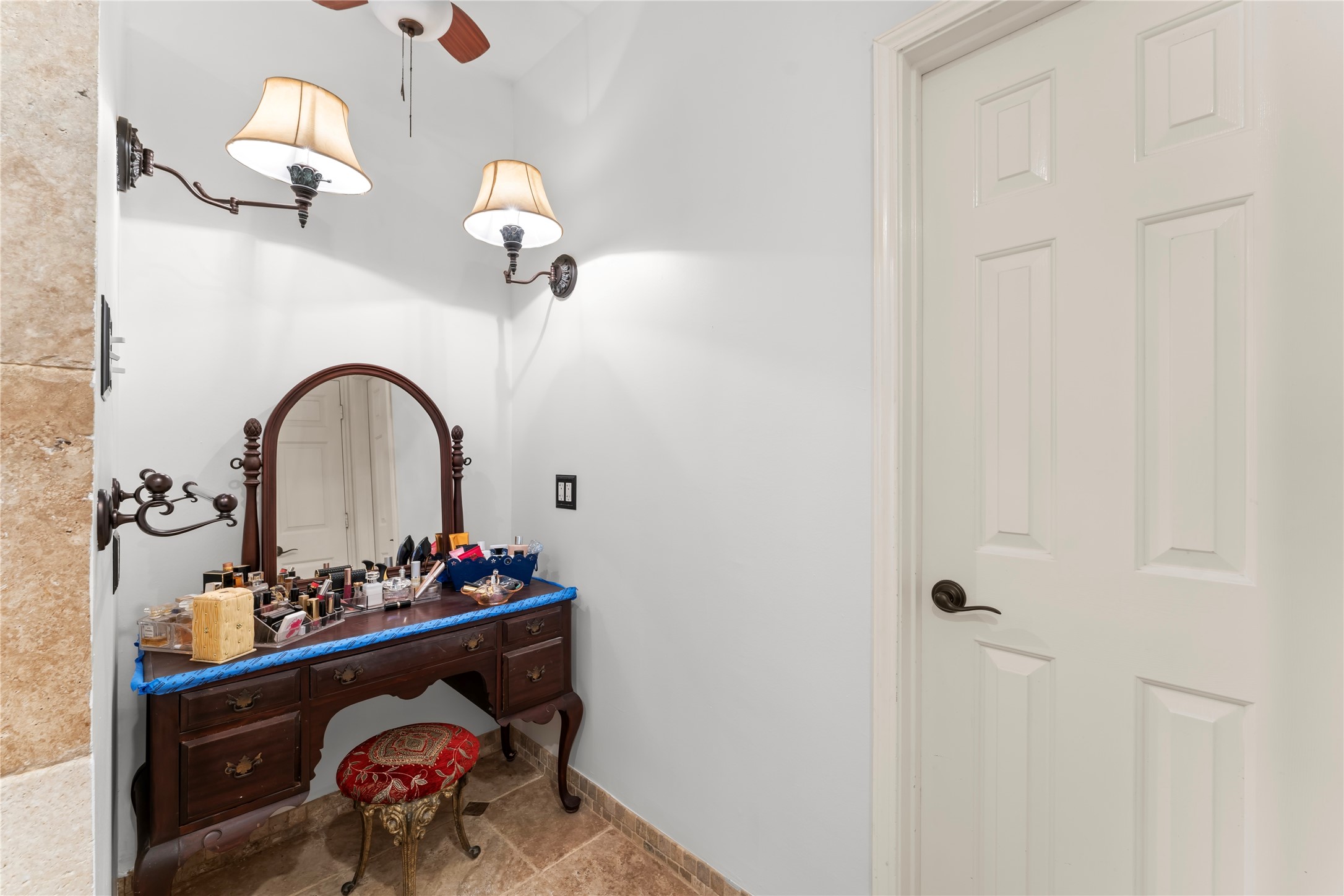 2922 Travick Lane Houston, TX 77073 - Photo 27 of 49 The primary bathroom features a versatile flex space currently utilized as a vanity area. This additional space serves as an elegant and functional zone for personal grooming and self-care, enhancing the overall experience of the bathroom. With a comfortable setup, it offers an ideal spot for getting ready for a night out on the town. The flexibility of this area allows for customization based on your needs, whether it be for storage, additional seating, or decor.