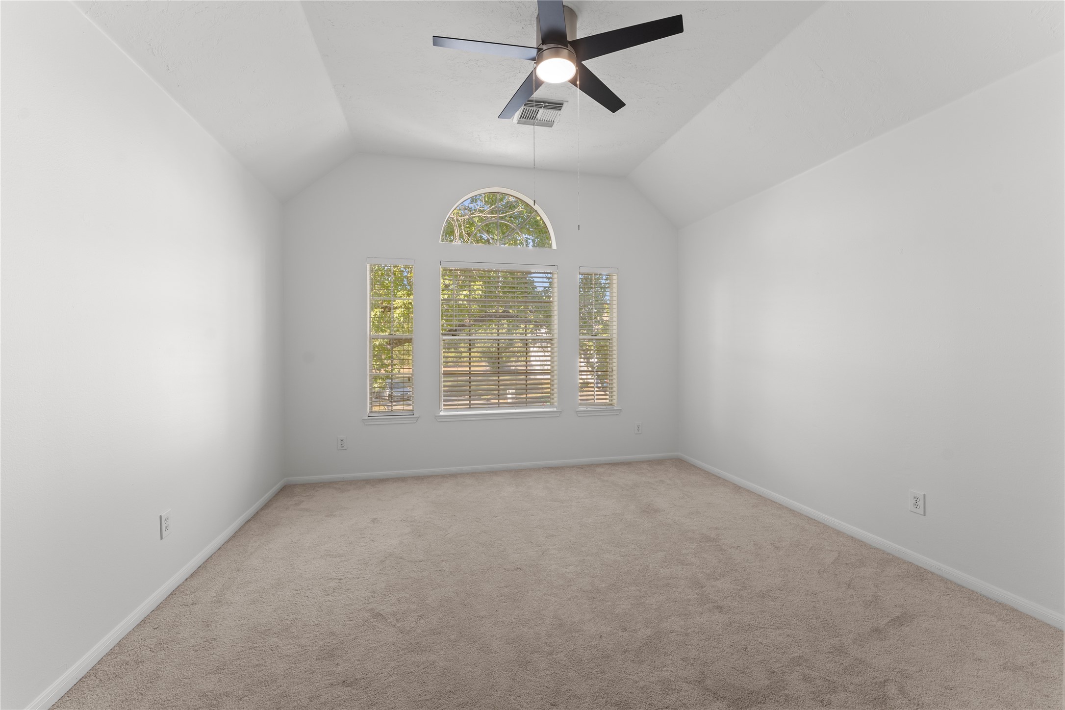 2922 Travick Lane Houston, TX 77073 - Photo 29 of 49 an empty room with windows and ceiling fan