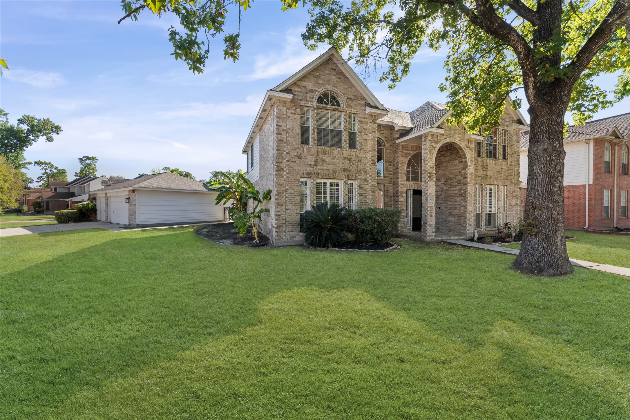 2922 Travick Lane Houston, TX 77073 - Photo 3 of 49 a front view of a house with a garden and plants