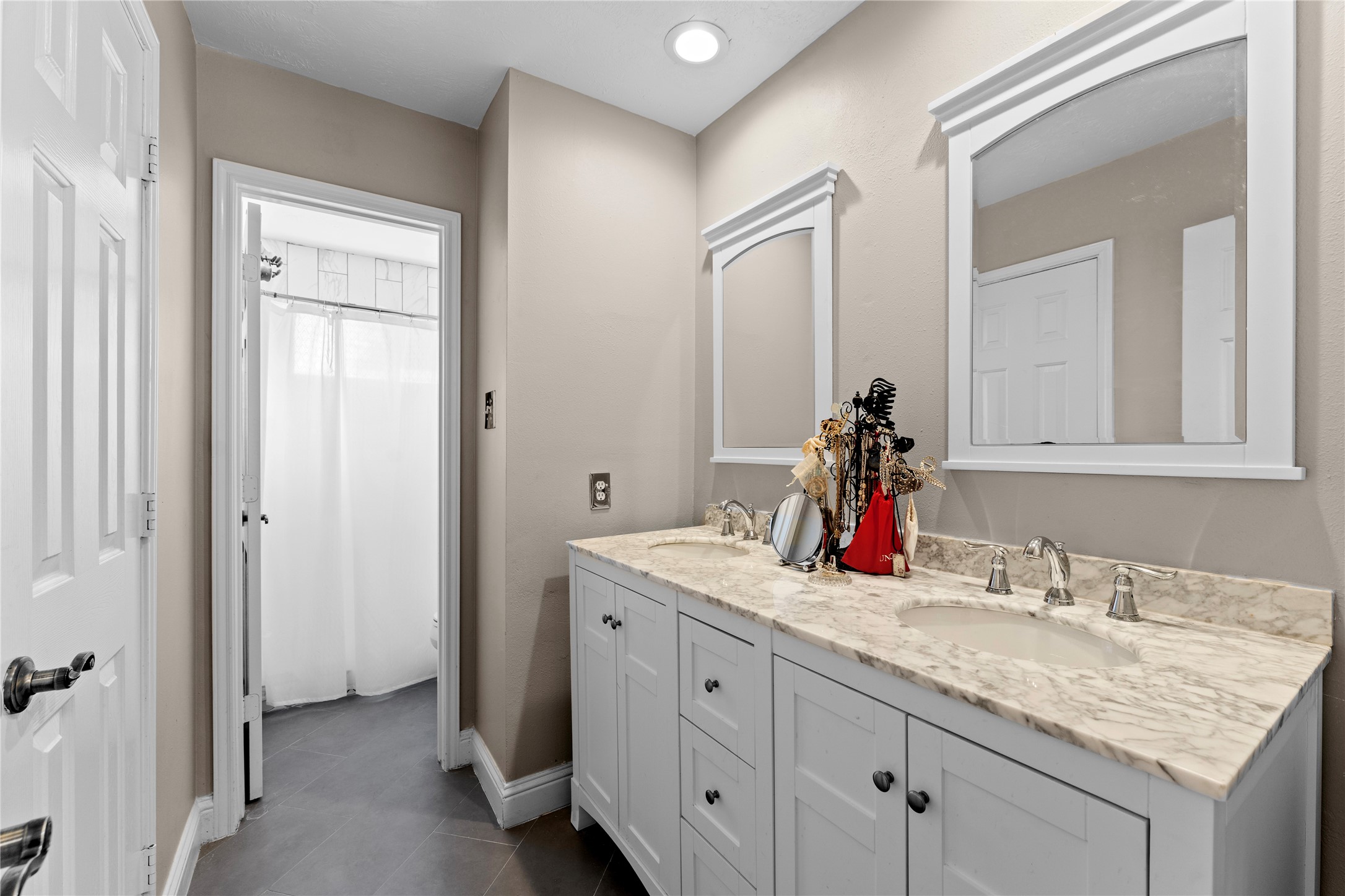 2922 Travick Lane Houston, TX 77073 - Photo 34 of 49 a bathroom with a granite countertop sink and a mirror