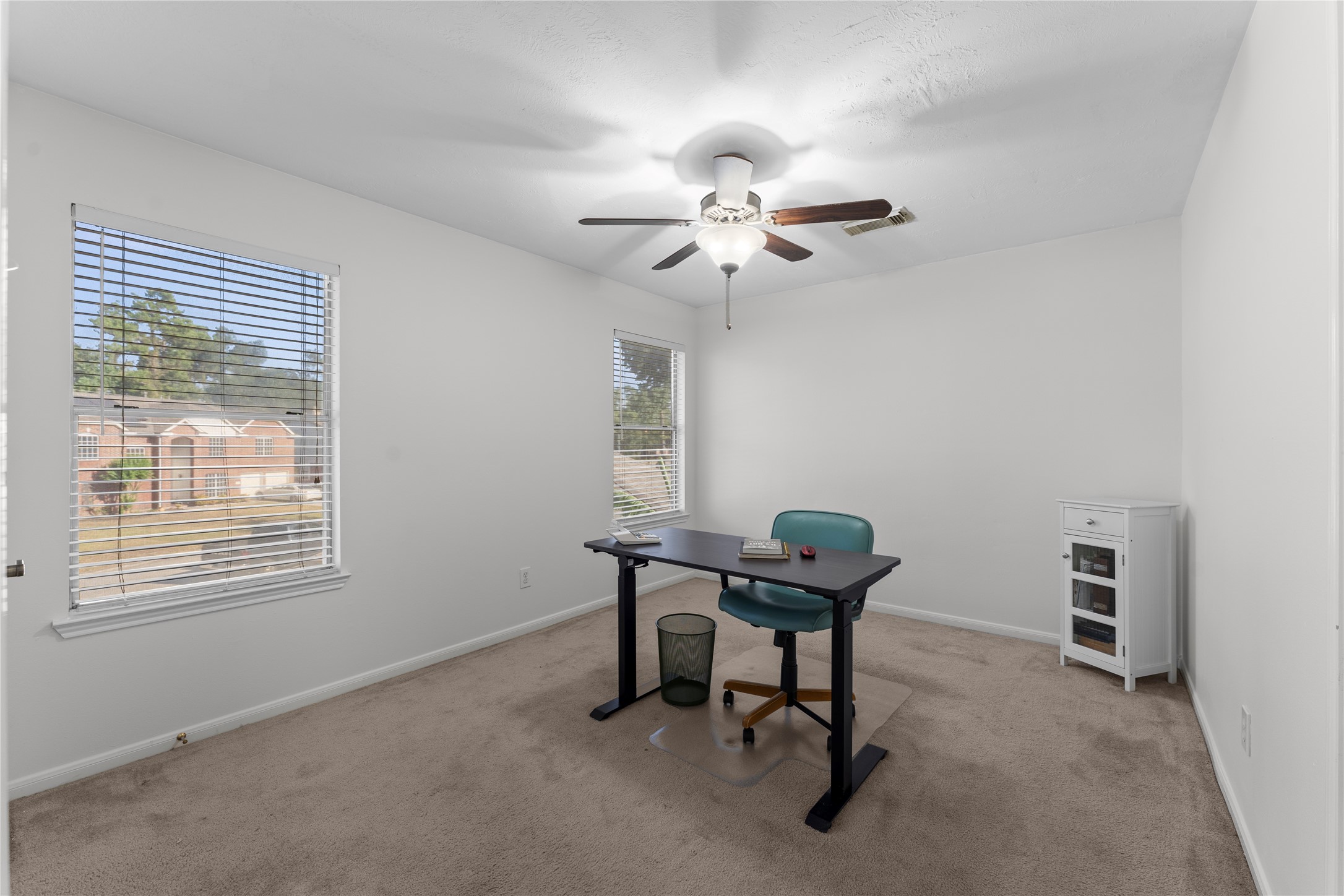 2922 Travick Lane Houston, TX 77073 - Photo 35 of 49 a view of a workspace with furniture and a window
