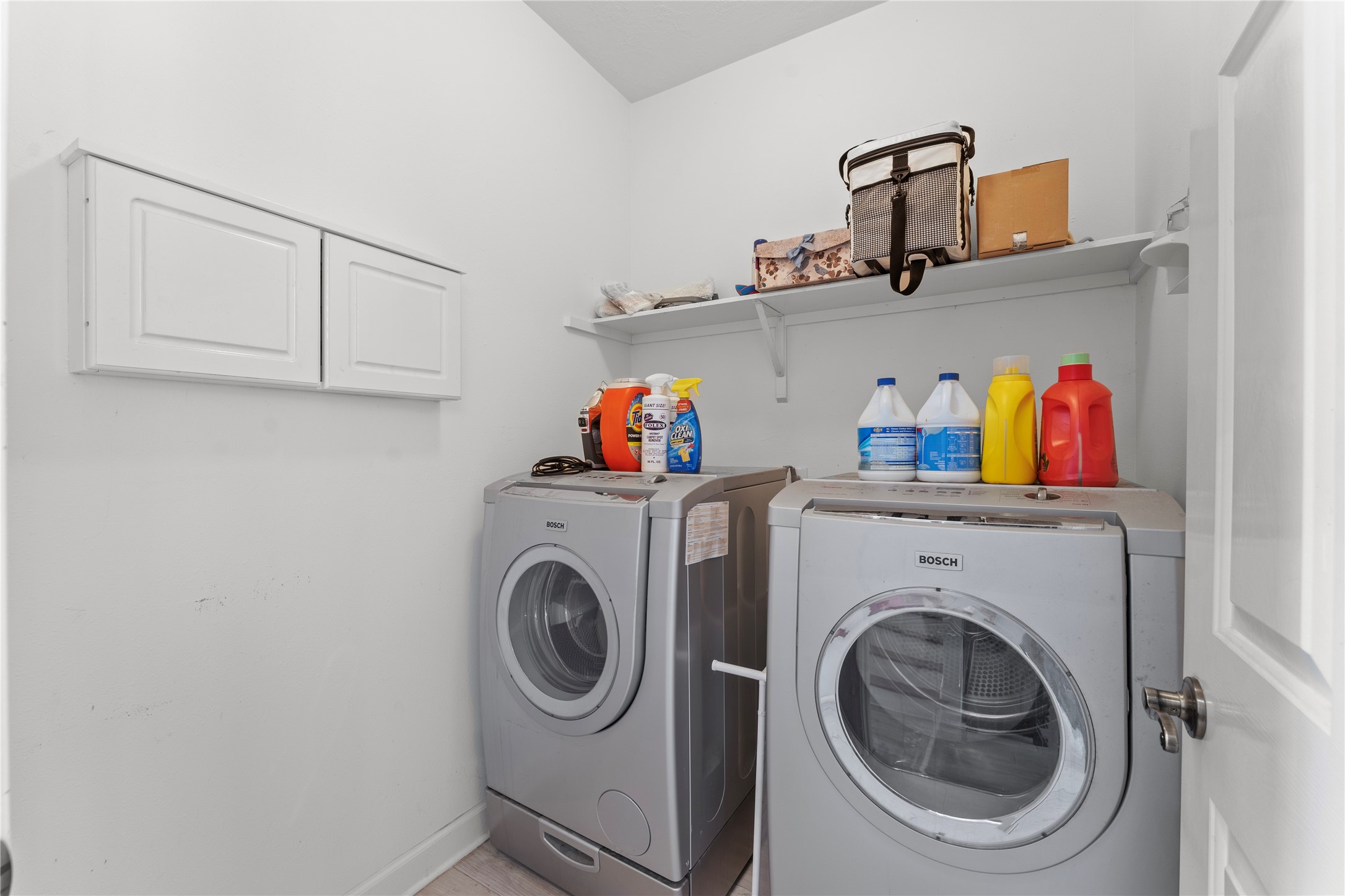 2922 Travick Lane Houston, TX 77073 - Photo 36 of 49 a view of storage and utility room with washer and dryer