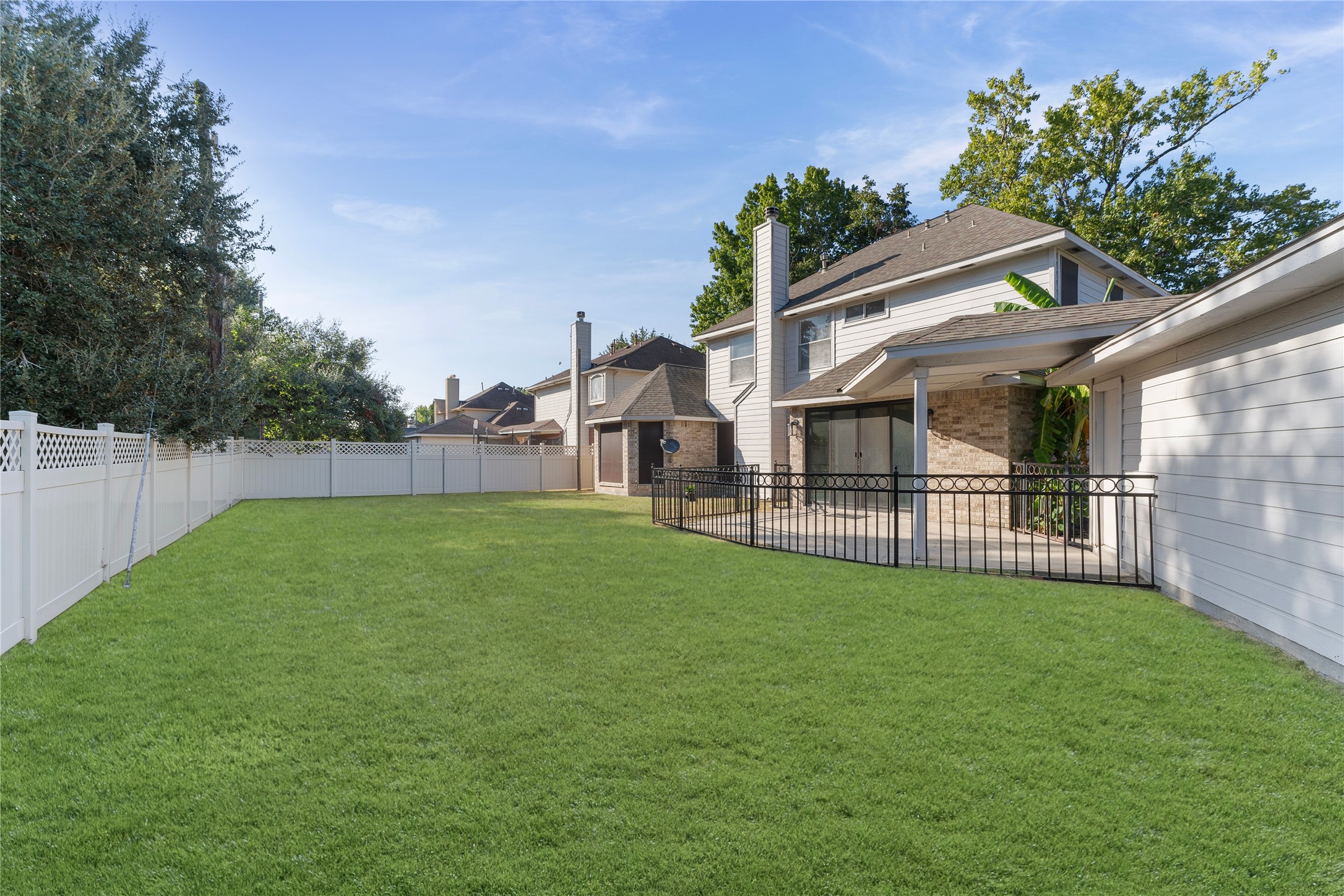 2922 Travick Lane Houston, TX 77073 - Photo 39 of 49 a view of a house with a backyard and a tree