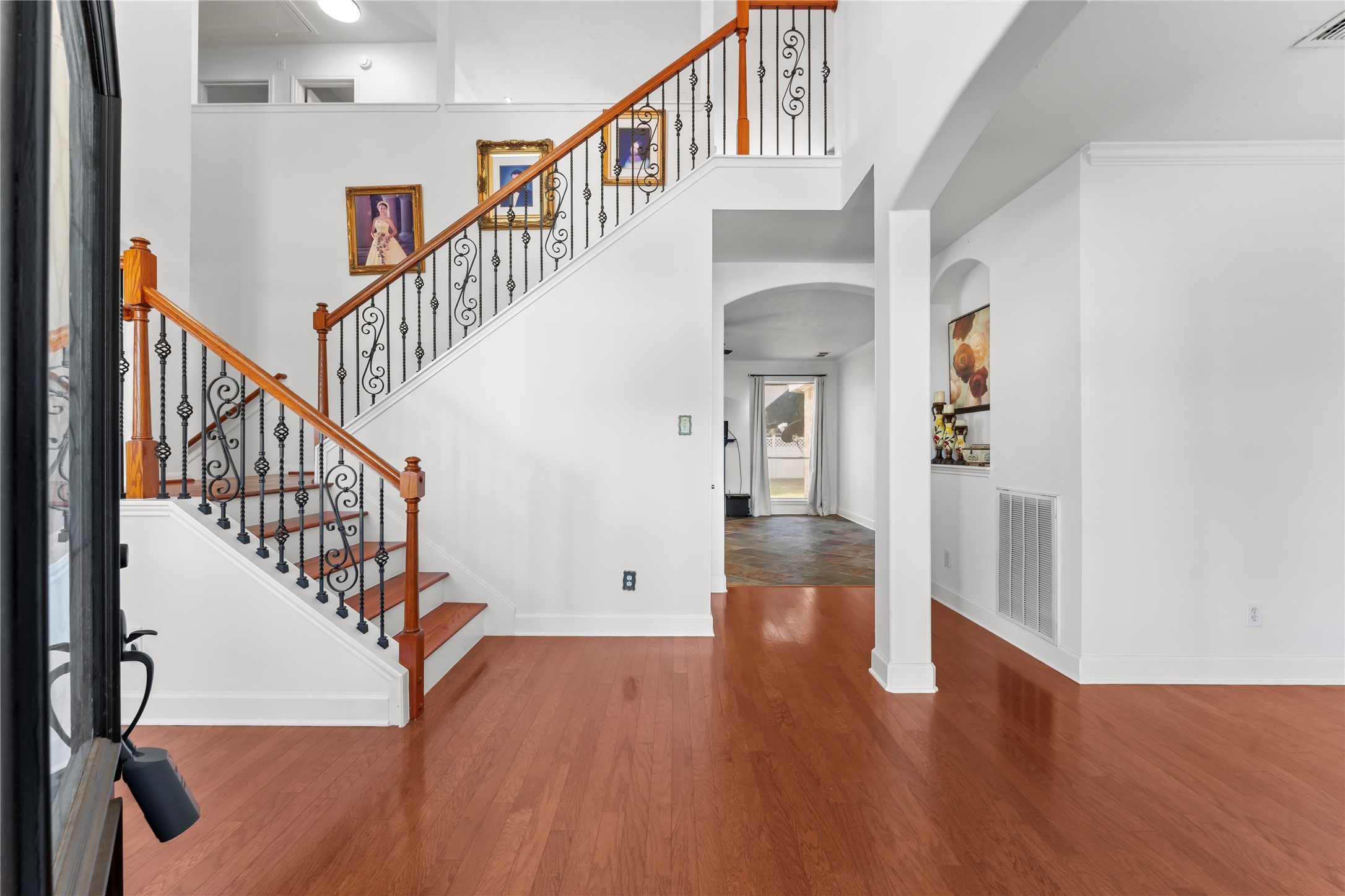 2922 Travick Lane Houston, TX 77073 - Photo 6 of 49 a view of staircase with wooden floor and a chandelier