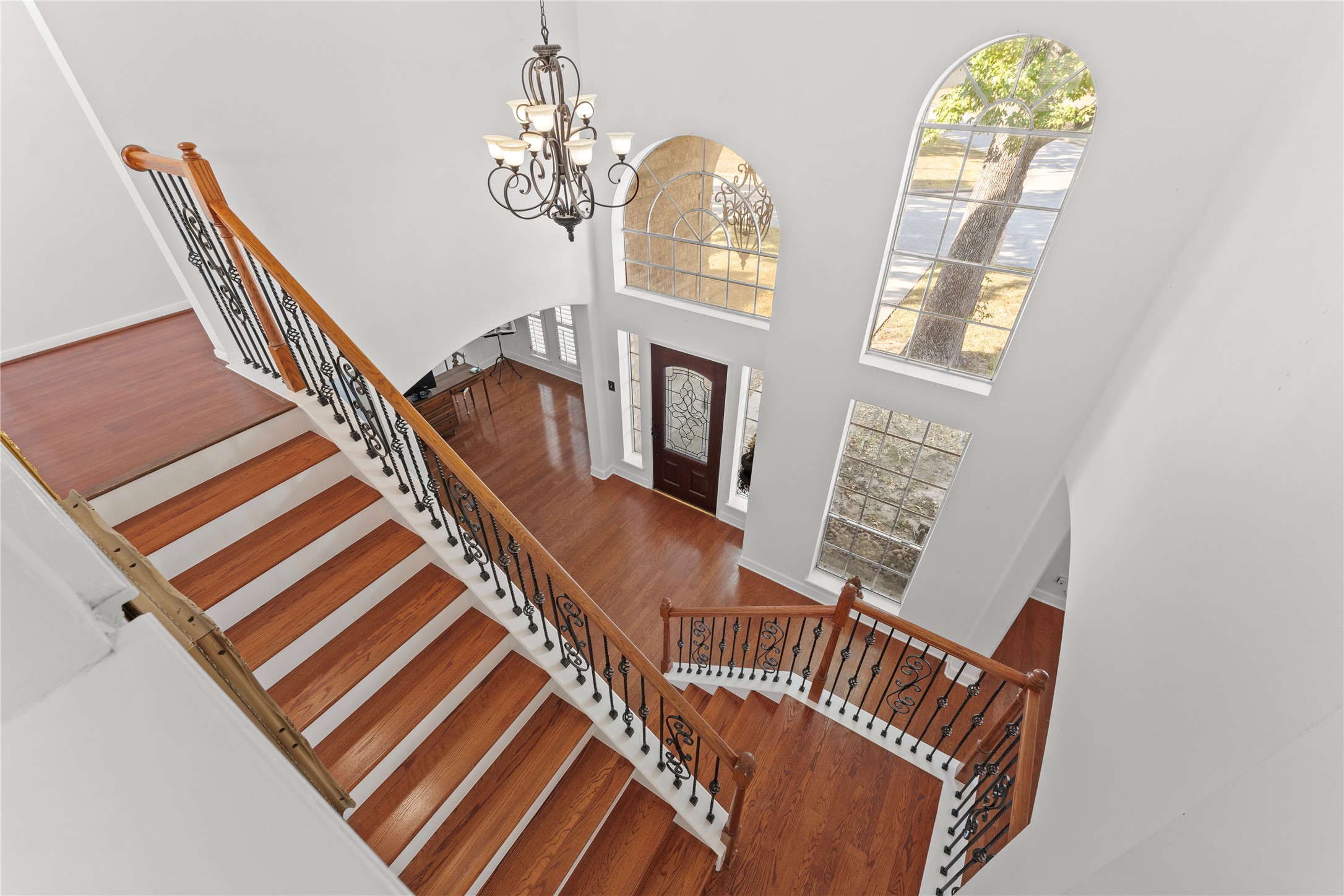 2922 Travick Lane Houston, TX 77073 - Photo 9 of 49 a view of stairs and hall with wooden floor