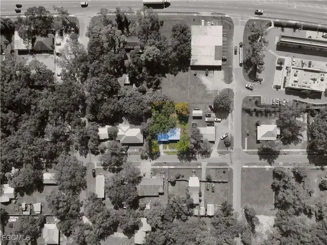 an aerial view of house with yard