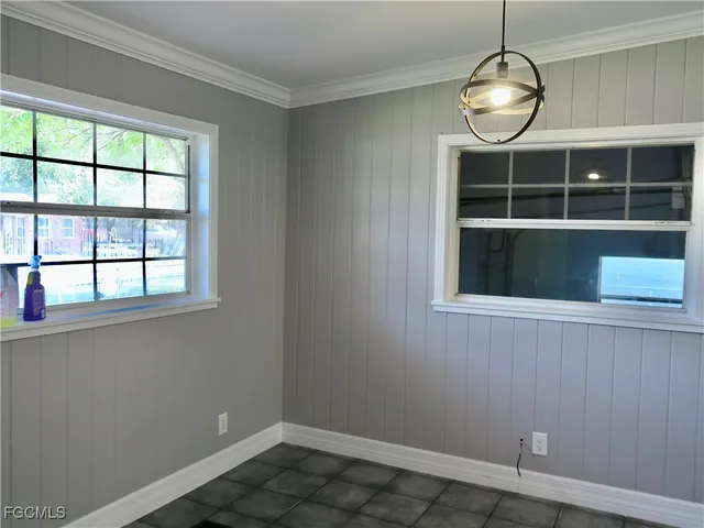 a view of wooden floor and chandelier in a room