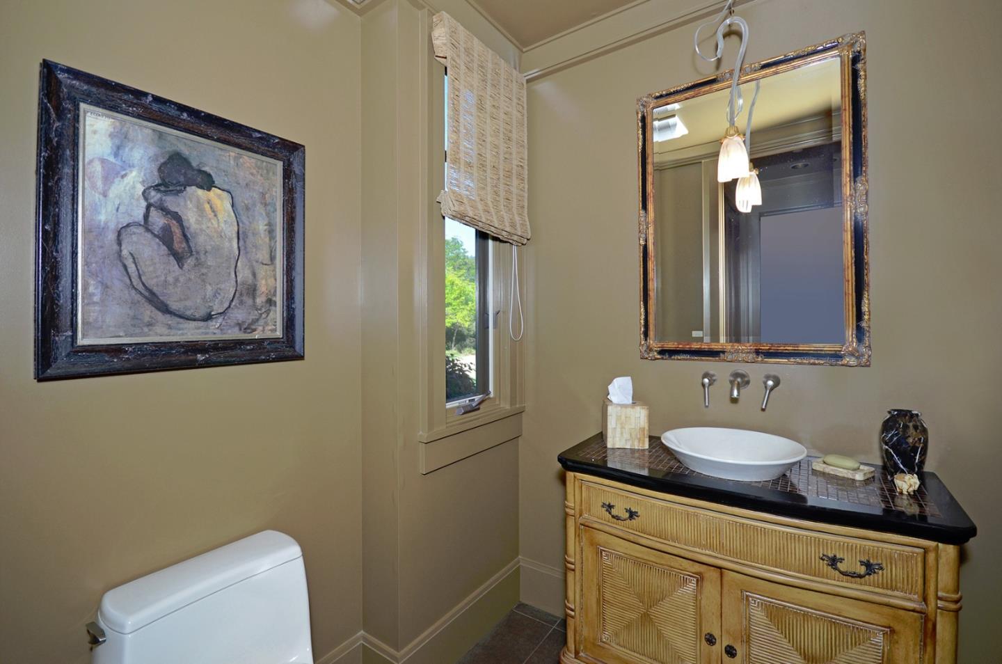 120 Edenvale Road Watsonville, CA 95076 - Photo 13 of 41 a bathroom with a toilet sink and mirror