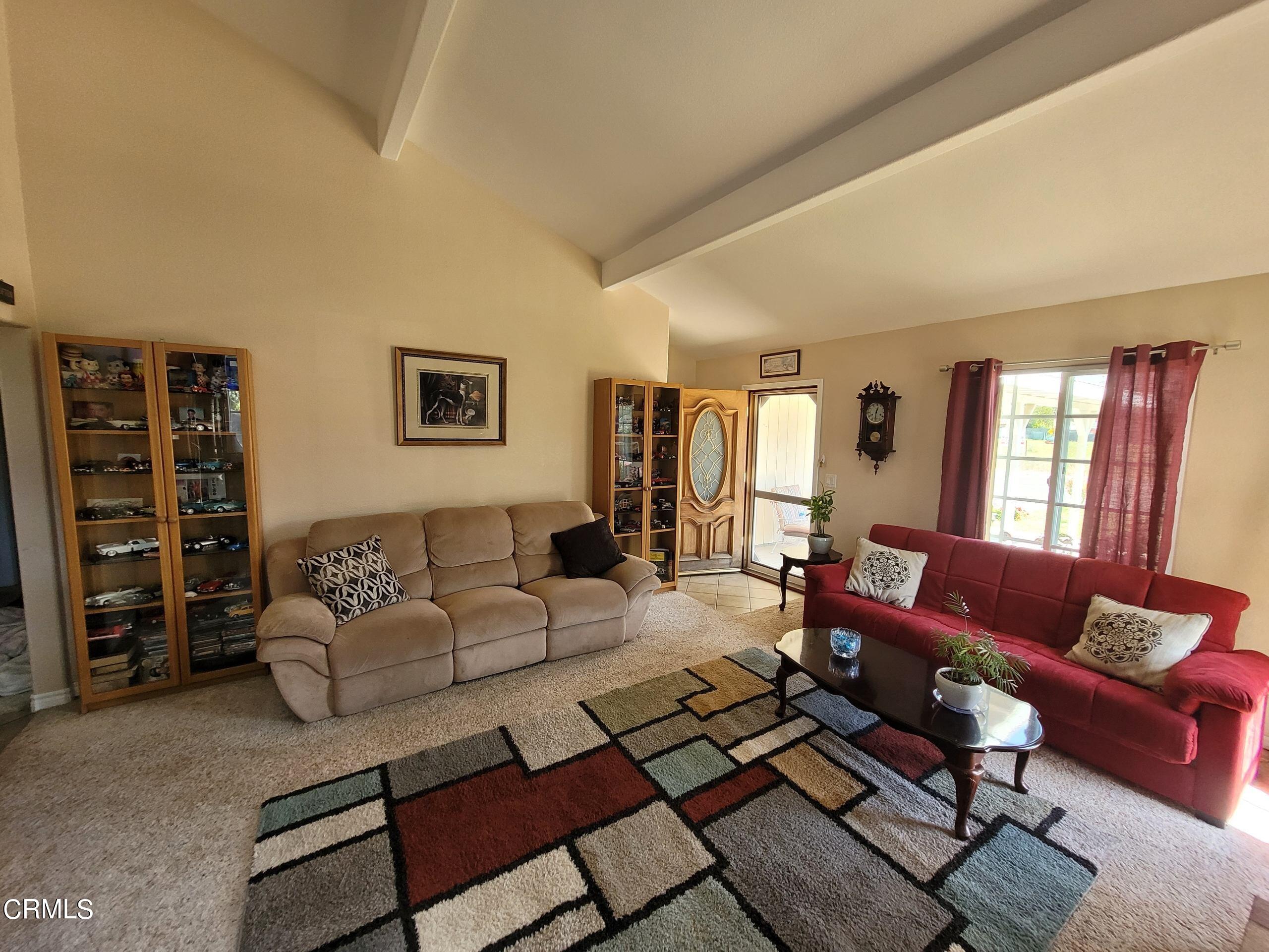 2059 Ralston Street Simi Valley, CA 93063 - Photo 12 of 34 a living room with furniture a rug and a window