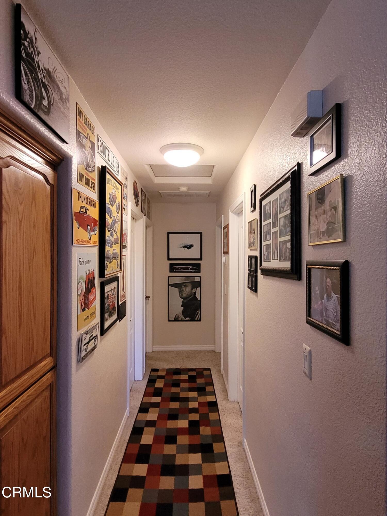 2059 Ralston Street Simi Valley, CA 93063 - Photo 18 of 34 a view of a hallway with wooden floor and staircase