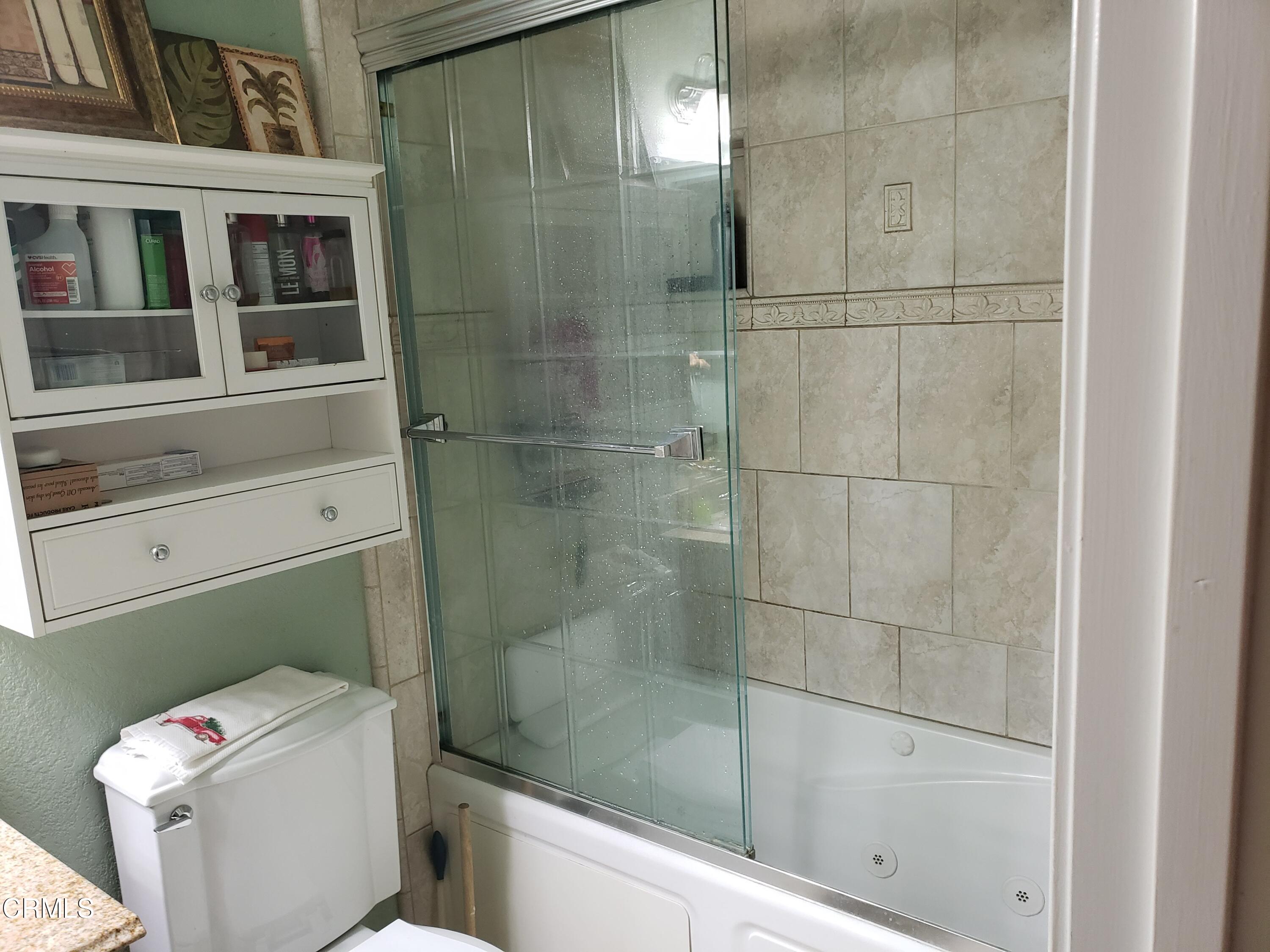 2059 Ralston Street Simi Valley, CA 93063 - Photo 20 of 34 a bathroom with a shower and toilet