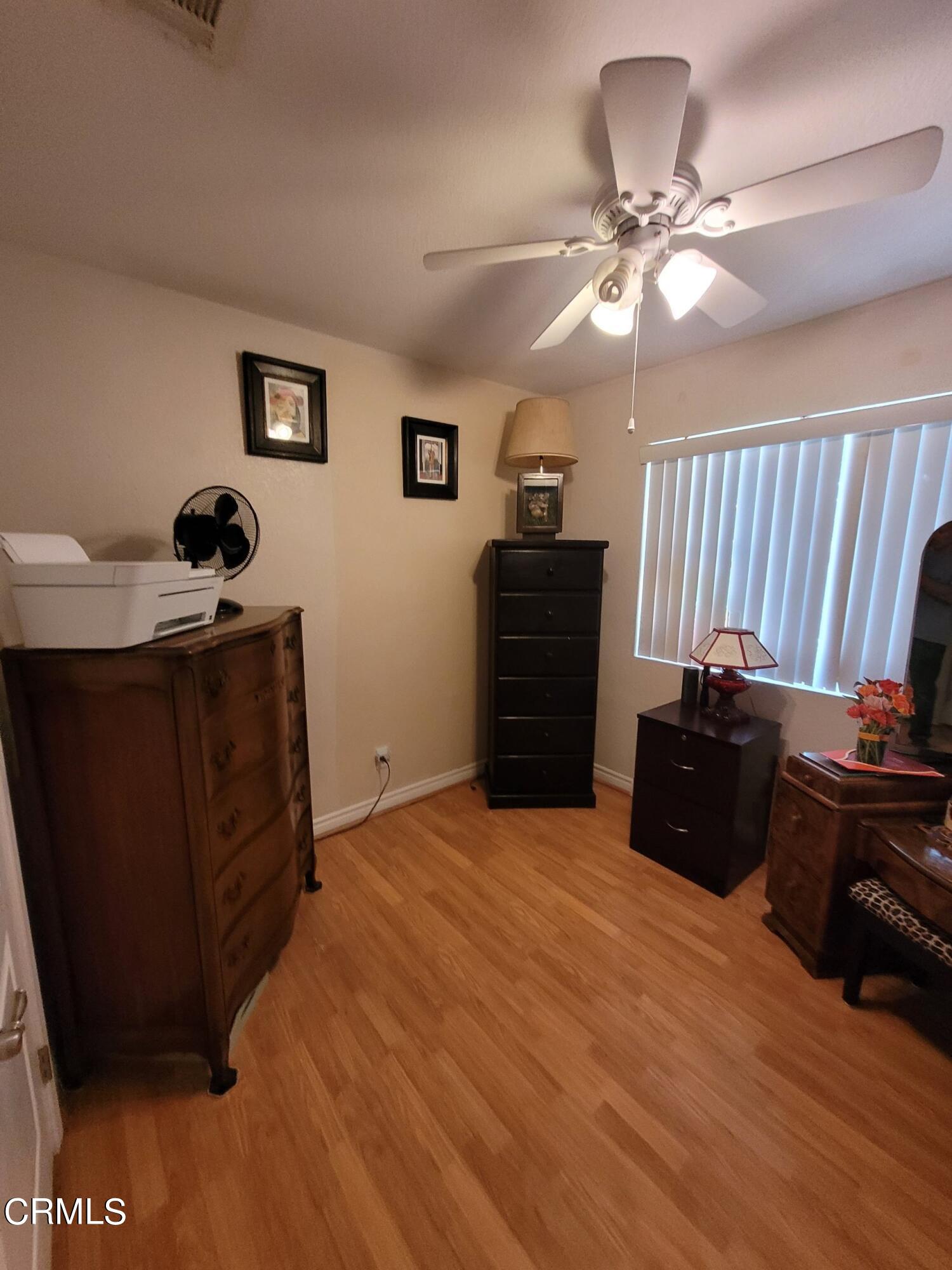 2059 Ralston Street Simi Valley, CA 93063 - Photo 25 of 34 a bed room with a bed and a television