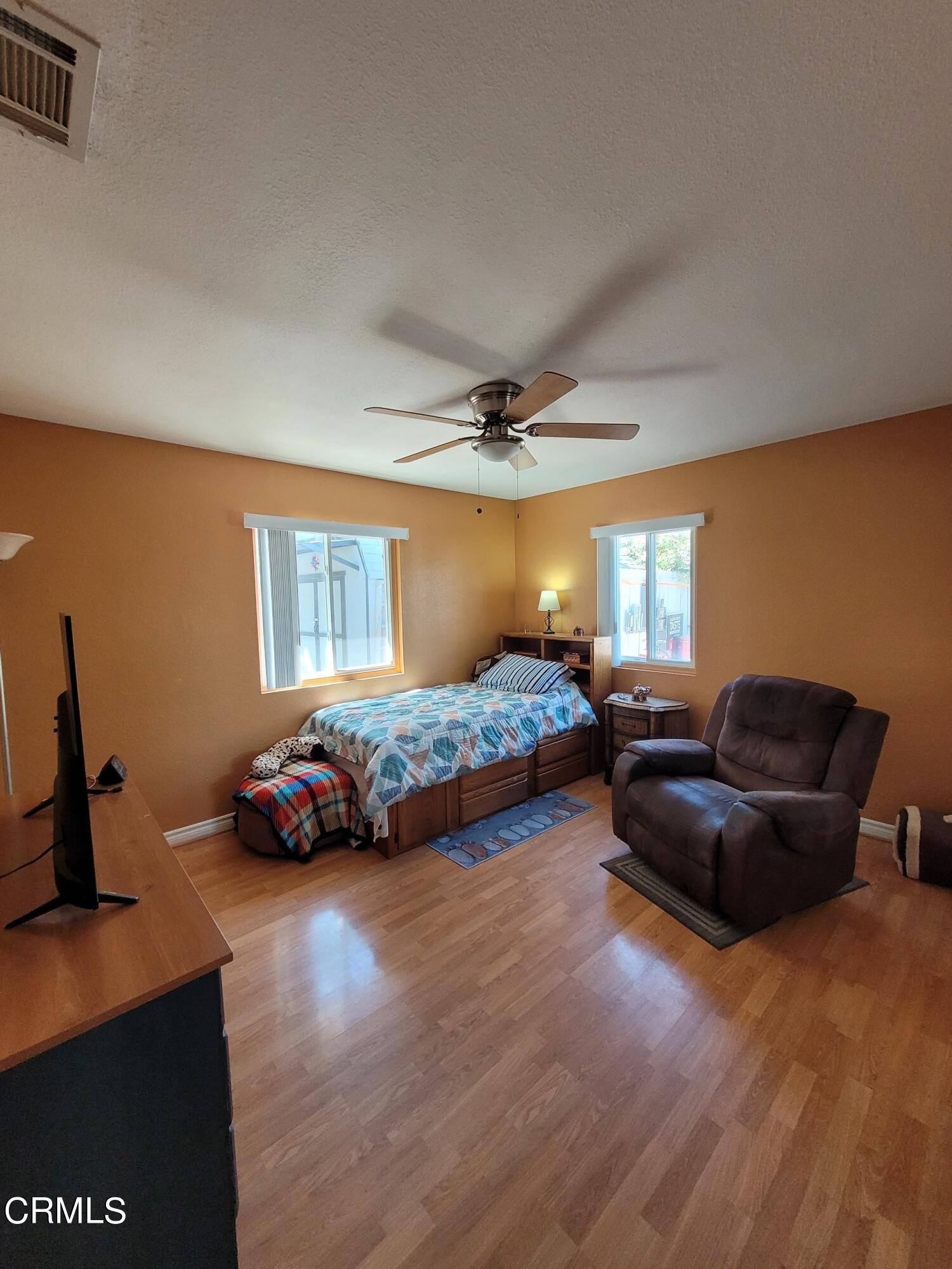 2059 Ralston Street Simi Valley, CA 93063 - Photo 28 of 34 a bedroom with a bed and a couch