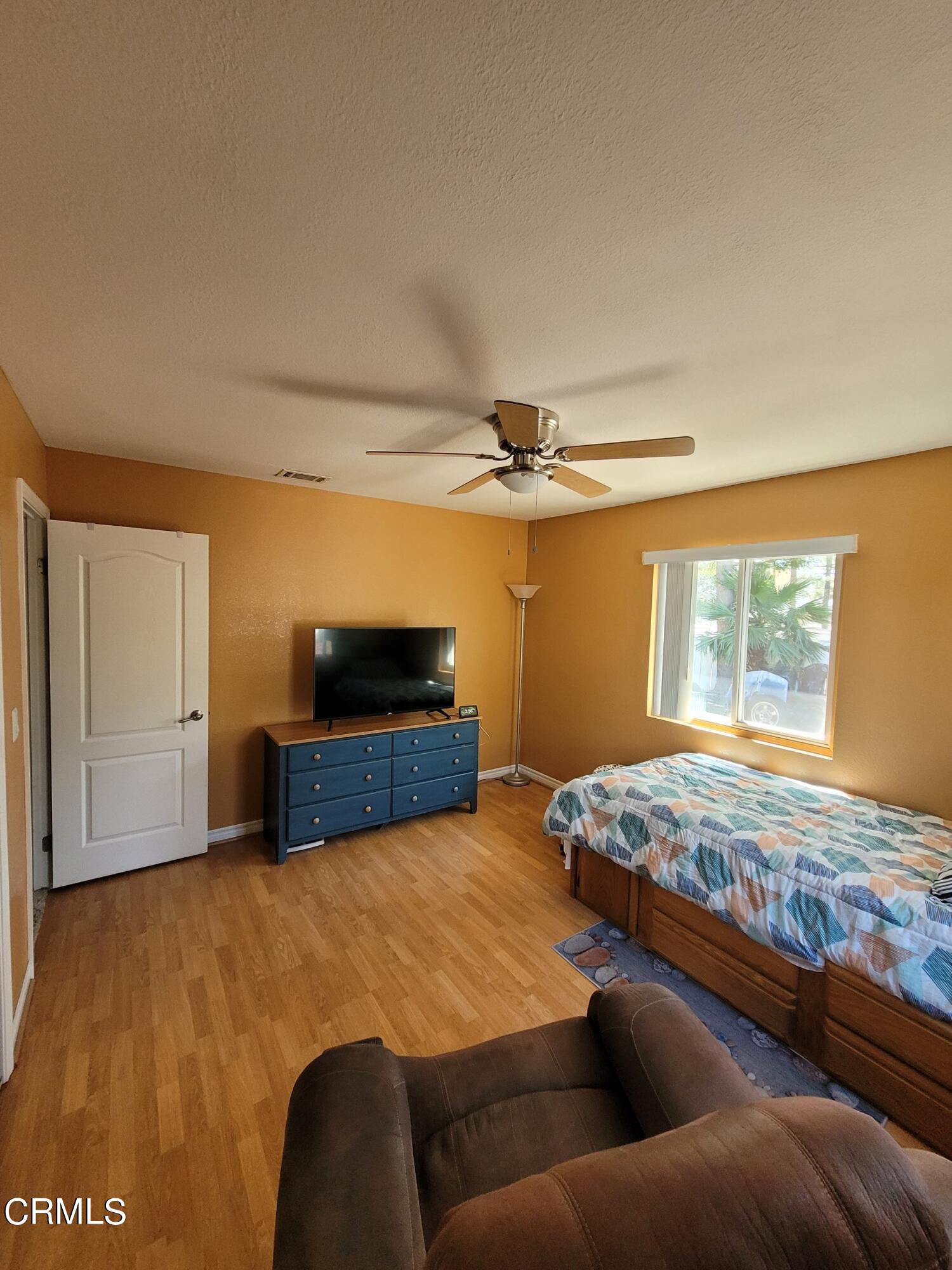 2059 Ralston Street Simi Valley, CA 93063 - Photo 29 of 34 a bedroom with a bed and dresser