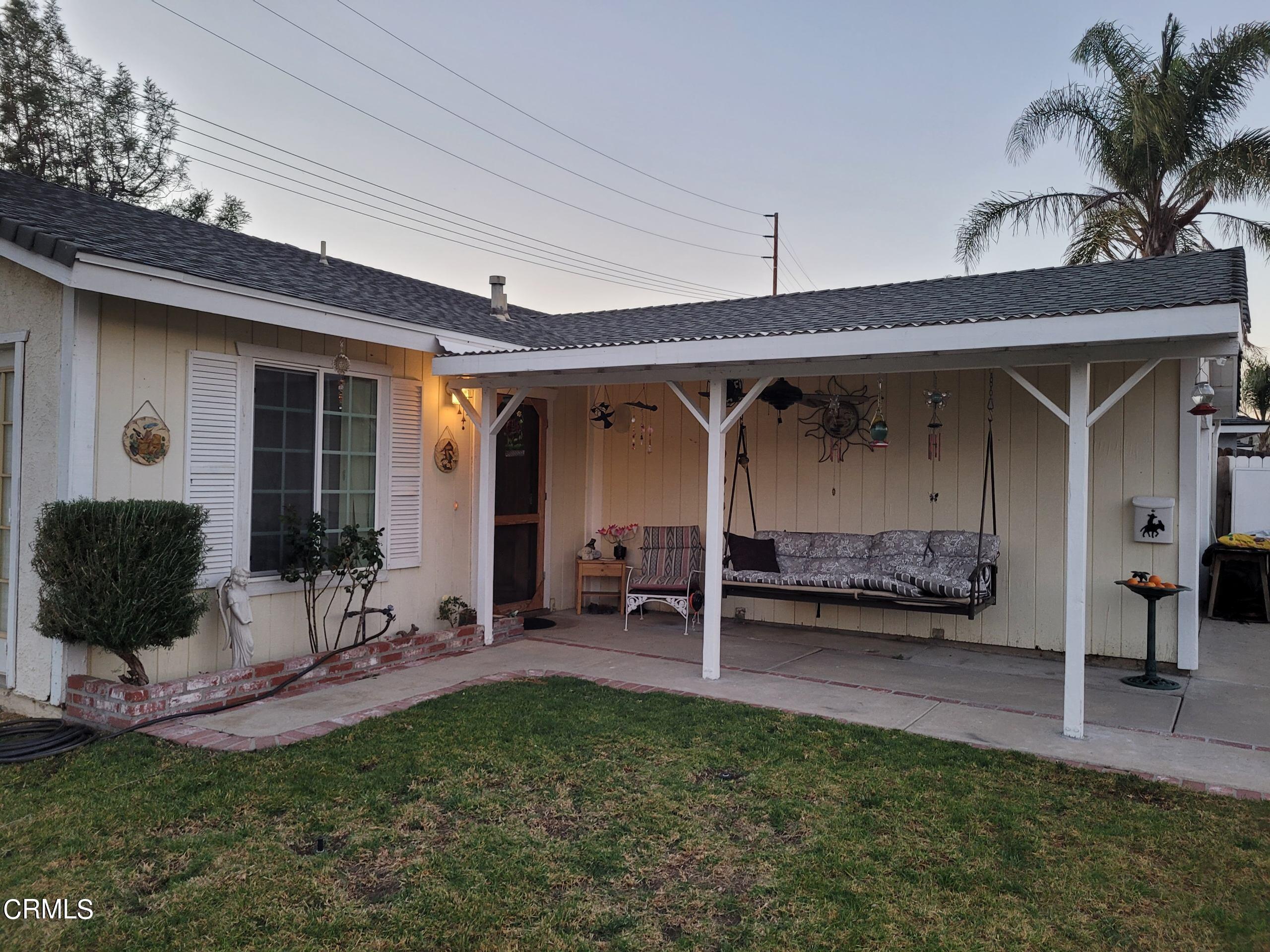 2059 Ralston Street Simi Valley, CA 93063 - Photo 5 of 34 a view of a porch with a table and chairs