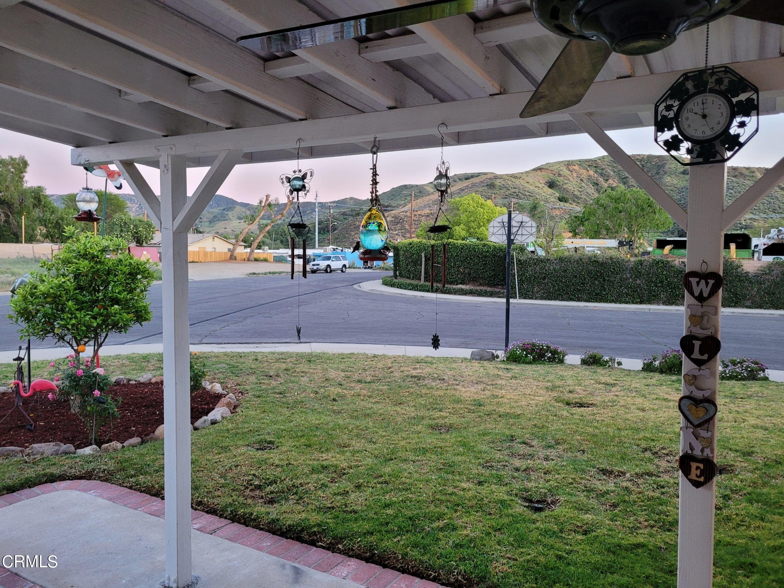 2059 Ralston Street Simi Valley, CA 93063 - Photo 8 of 34 a backyard of a house with a garden and outdoor seating