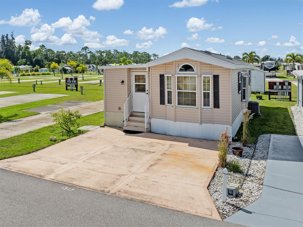 1317 Trout Punta Gorda, FL 33950 - Photo 1 of 55 a front view of a house with a yard