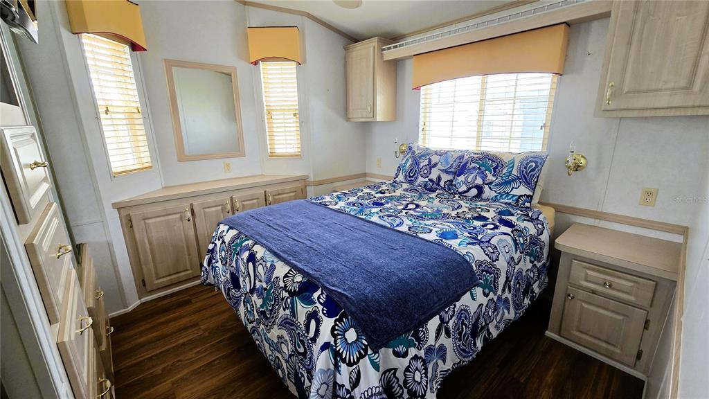 1317 Trout Punta Gorda, FL 33950 - Photo 18 of 55 a bed sitting in a bedroom next to a window